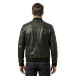 Rear view of a man wearing a dark gray leather bomber jacket with ribbed collar and cuffs, paired with blue jeans, standing against a white background.