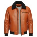 Front view of a caramel-colored leather jacket with a textured finish, featuring a black shearling-style collar, zippered chest and side pockets, and ribbed black cuffs and waistband