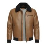 Front view of a tan brown leather jacket with a textured finish, featuring a black shearling-style collar, zippered chest and side pockets, and ribbed black cuffs and waistband.