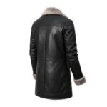 Back view of a black leather coat with light beige fur lining on the collar and cuffs. The coat features clean stitching and a tailored design.