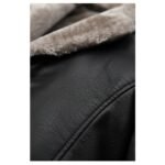 Close-up of the black leather material and light beige fur lining of a coat, showcasing the texture and stitching details.