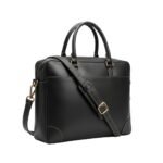 A sleek black leather laptop bag featuring gold accents, dual handles, and an adjustable shoulder strap.