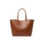 A sleek brown leather tote bag with a minimalist design, sturdy handles, and a smooth, polished finish.