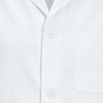 Close-up of white lab coat fabric for doctors showing texture, stitching, and seam detail.