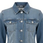 Close-up view of a light blue denim jacket with button-up front, chest pockets, and faded detailing.