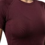 Women’s black compression shirt, close-up front view.