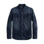 Dark blue men's denim button-down shirt fully buttoned with two button-flap chest pockets and long sleeves on white background.