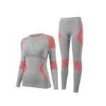 Brick red women’s seamless ski base layer set with long-sleeve top and leggings, front view on a white background.