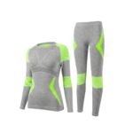 Bright lime green women’s seamless ski base layer set with long-sleeve top and leggings, front view on a white background.