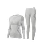 Long-sleeve seamless grey women’s ski base layer top and matching leggings, front view on a white background.