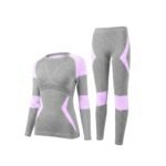 Light purple women’s seamless ski base layer set with long-sleeve top and leggings, front view on a white background.