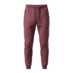 Reddish brown men’s tapered joggers, front view on a white background.