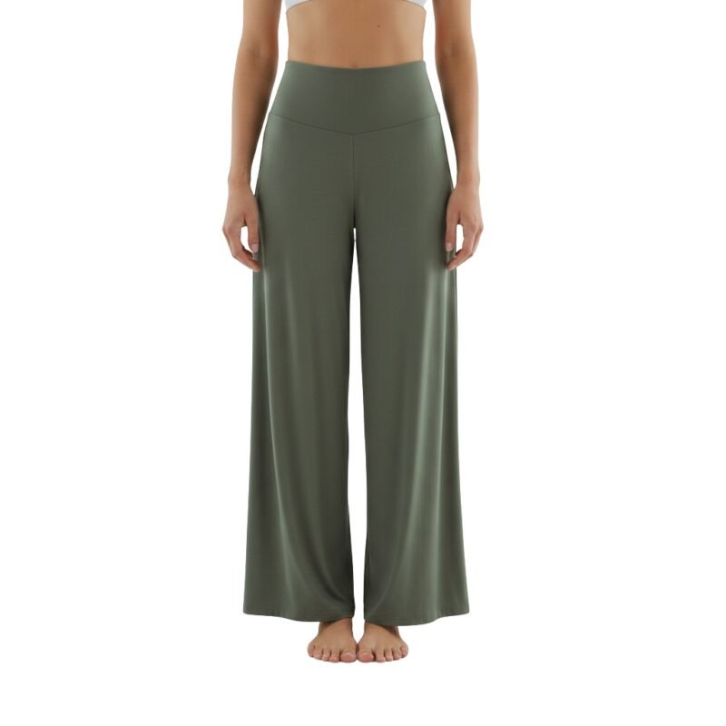 Front view of a woman wearing wide-leg yoga pants and a fitted top, standing in a relaxed pose.