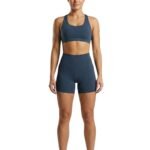 Woman wearing black gym shorts, front view.