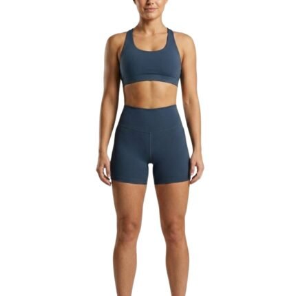 Woman wearing black gym shorts, front view.