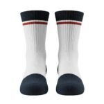 Full front view of yellow-green basketball soft socks laid flat, showing the calf-length design, ribbed cuffs, cushioned footbed, and small logo icon near the top.