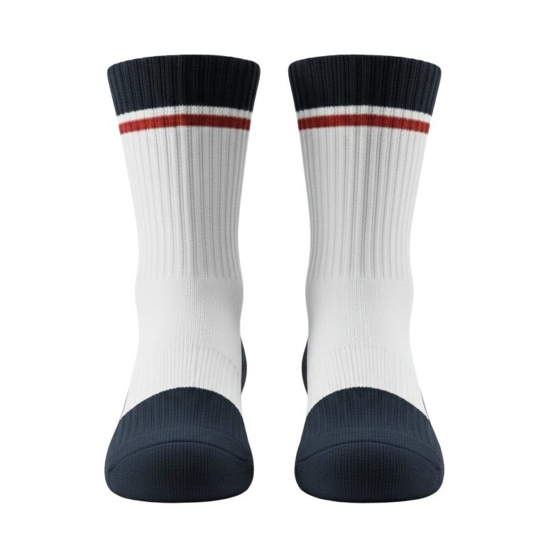 Full front view of yellow-green basketball soft socks laid flat, showing the calf-length design, ribbed cuffs, cushioned footbed, and small logo icon near the top.