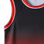 Close-up view of the basketball team uniform jersey, showing the bold chest number, logo icon, and detailed stitching on the lightweight performance fabric.