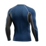 Ice hockey long sleeve compression shirt laid flat, featuring a crew neck, contrast stitching, and a tight athletic baselayer fit.
