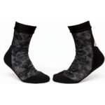 Pair of MMA training socks laid flat, showing mid-length cuffs, reinforced heel and toe areas, and a textured non-slip grip sole pattern.