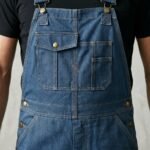 Close-up view of men’s overalls material and fabric texture.