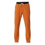 Front view logo icon on men’s badminton pants made from lightweight performance fabric, shown on a plain background.