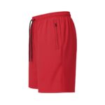 Side view of men’s badminton shorts made from lightweight performance fabric, showing the relaxed athletic fit and small logo icon near the hem on a plain background.
