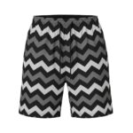 Front view of men’s badminton shorts made from lightweight performance fabric, laid flat on a plain background with a small logo icon near the hem.