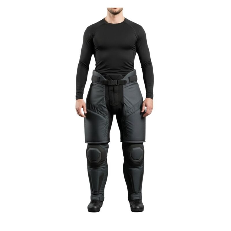 Model wearing men’s senior fitted ice hockey pants, angled front view, showing padded protection and adjustable waist.