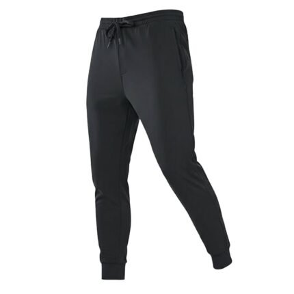 Front view of men’s rugby joggers in dark color with elastic waistband, drawstring, tapered legs, and ankle cuffs, displayed on a plain background.