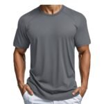 Model wearing a men’s short sleeve performance tennis T‑shirt, shown from the front in a relaxed stance to highlight the crew neckline, set‑in sleeves, and athletic, easy‑move fit.