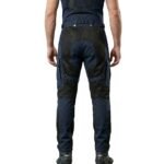 Model wearing mesh motorbike pants back view, showing full-length breathable riding trousers from behind.