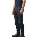 Model wearing mesh motorbike pants side view, showing the profile fit of full-length breathable riding trousers.