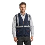 Model wearing navy safety vest, front view on plain background.