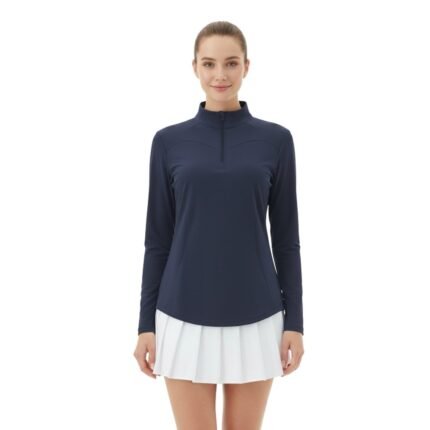 Model wearing a women’s quarter‑zip long sleeve golf dress, shown standing in a relaxed pose to highlight the tailored fit, long sleeves, and above‑the‑knee athletic silhouette.
