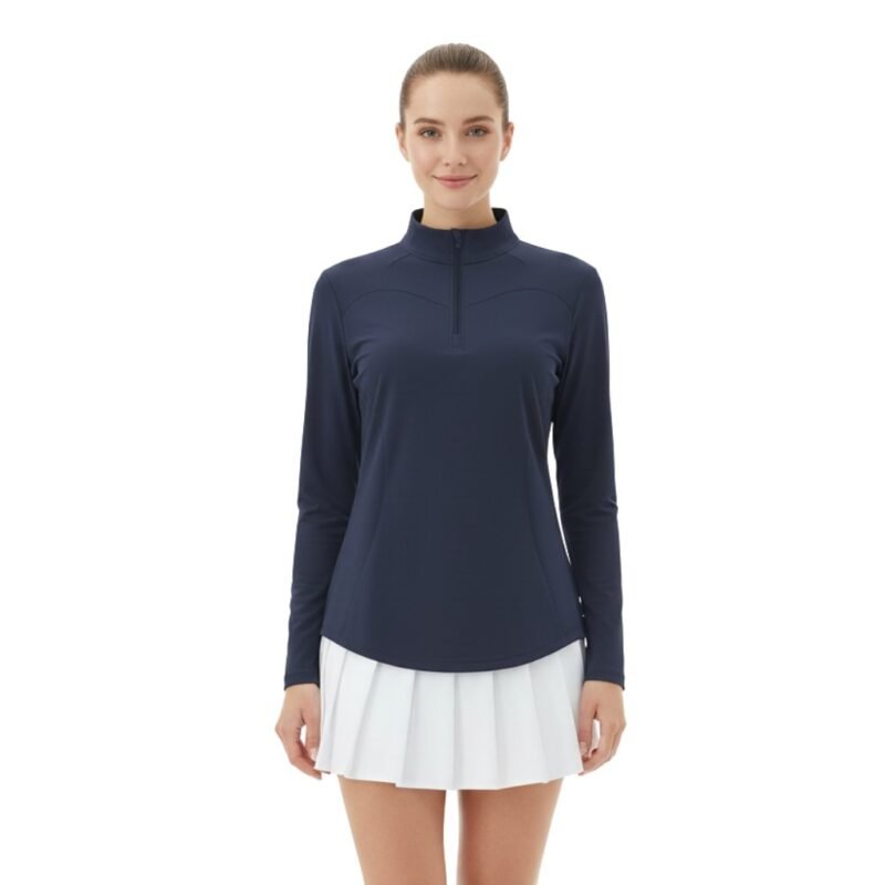 Model wearing a women’s quarter‑zip long sleeve golf dress, shown standing in a relaxed pose to highlight the tailored fit, long sleeves, and above‑the‑knee athletic silhouette.
