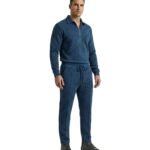 Dark blue men’s polo tracksuit laid out in a clean studio view.