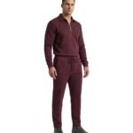 Maroon-colored men’s polo tracksuit laid out in a clean studio view