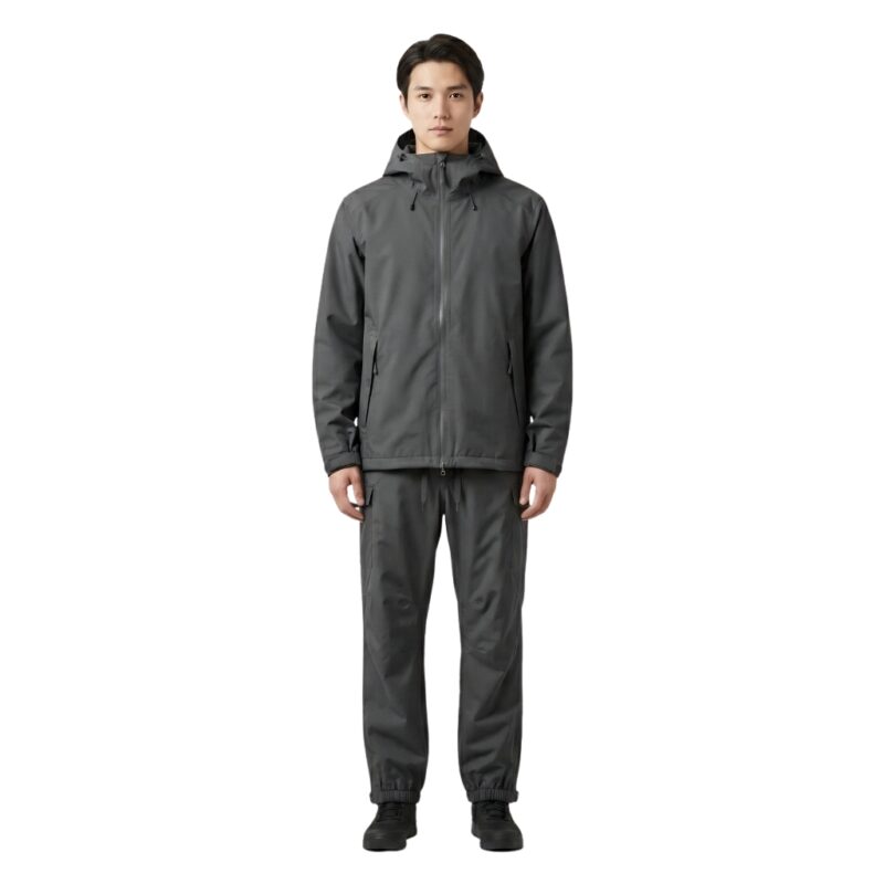 Male model wearing custom charcoal grey rainwear jacket and trousers front view – waterproof outdoor apparel