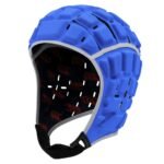 Front view of a black rugby headguard with soft padded panels, ventilation holes, and an adjustable chin strap, shown against a plain background.