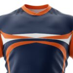 Close-up front view of a rugby team jersey on a mannequin, showing the patterned chest panel, short sleeves, and part of the matching shorts.