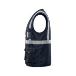 Side view of navy workwear vest on plain background.