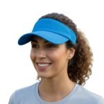 Woman wearing a golf sun visor hat, shown from the front in a relaxed pose, highlighting the curved brim and open‑top design for lightweight, cooling sun protection on the course