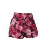 Front view of women’s badminton shorts made from lightweight quick-dry fabric, laid flat on a plain background with a small logo icon near the hem.