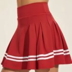 Front view of women’s badminton skorts on a model, featuring a flat waistband, flared mini skirt silhouette, and built‑in shorts designed for quick‑dry, high‑movement athletic play.