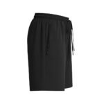 Side view of women’s golf shorts laid flat, showing the mid‑thigh length, side seam, waistband, and pocket opening in stretch quick‑dry fabric