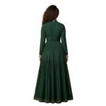 Woman wearing a green maxi dress back view, showing ankle‑length skirt and relaxed, flowing silhouette.