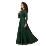 Woman wearing a green maxi dress side view, showing flowing ankle‑length skirt and relaxed silhouette.