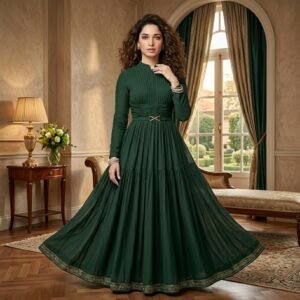 Woman wearing a green maxi dress, standing outdoors against a softly blurred background, showing full‑length flowy silhouette.