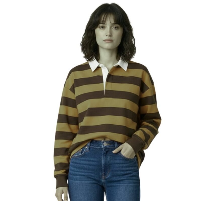 Female model wearing a women’s rugby long sleeve shirt with buttoned collar and front logo icon, standing against a plain background.